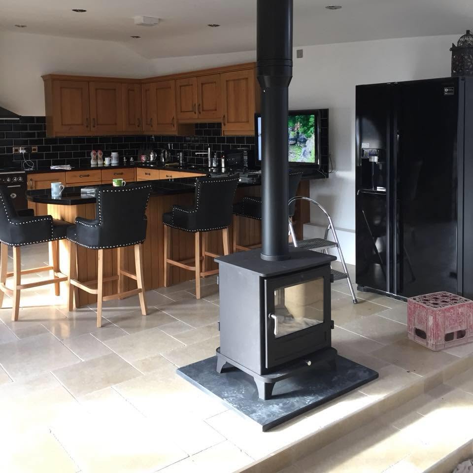 Completed freestanding stove installation in a kitchen